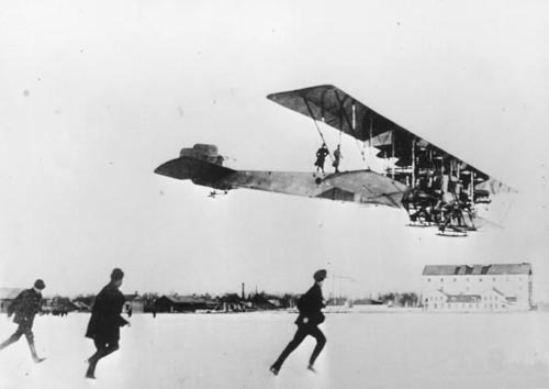 “Igor Sikorsky’s ‘Ilya Muromets’, the world’s biggest, and first four-engined passenger plane. Equipped with a cabin, washroom, and space for 16 passengers, the Ilya Mourometz was even fitted with a promenade over the fuselage, so passengers could take a stroll outside if they wished.”  EDIT: This photo, as far as I am aware, is genuine. Please let me know if you know otherwise!