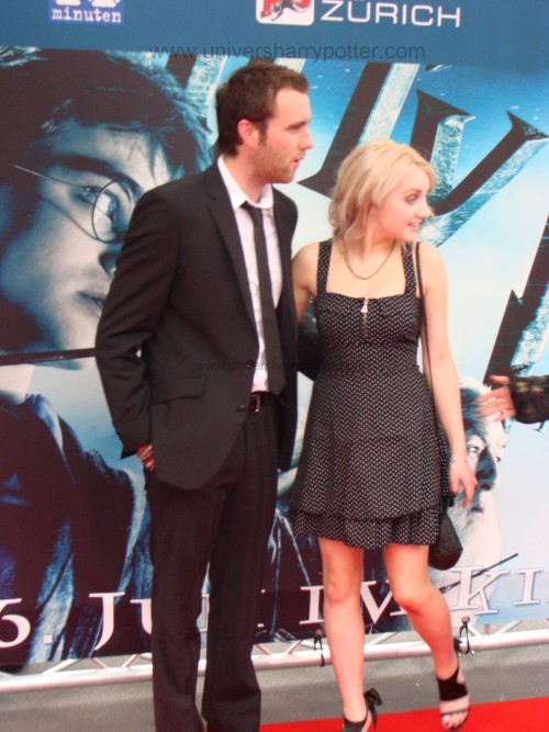 arseniccupcakes:   cherrylolita:   fuckyeahevanna:  With Matt Lewis at the Swiss Half-Blood Prince Premiere. Matt is handsome (not the best photo). He makes me want to ship Neville/Luna. I like how Evanna is dressed. What do you think?  She’s grooving up into a beautiful lady.     That dress…